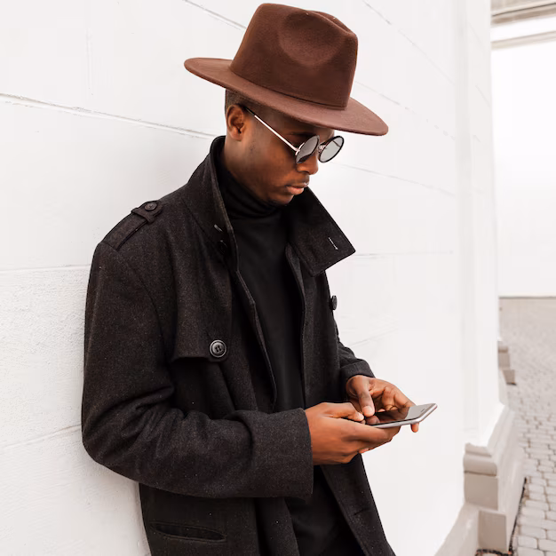 handsome-young-male-texting-his-mobile-phone_23-2148466022.avif